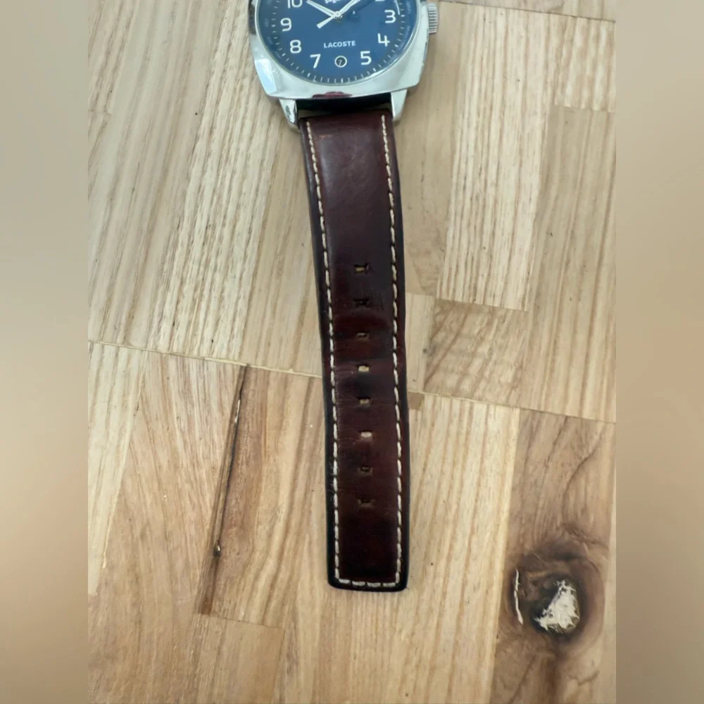Lacoste mens blue dial silver tone brown leather watch NEW BATTERY